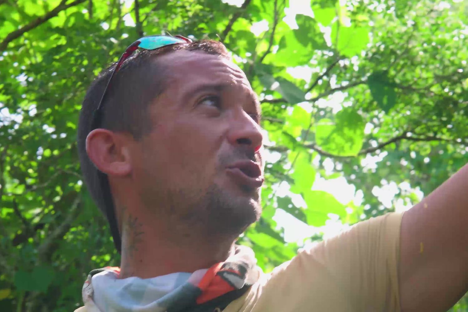 Darwin Sosa points toward the forest