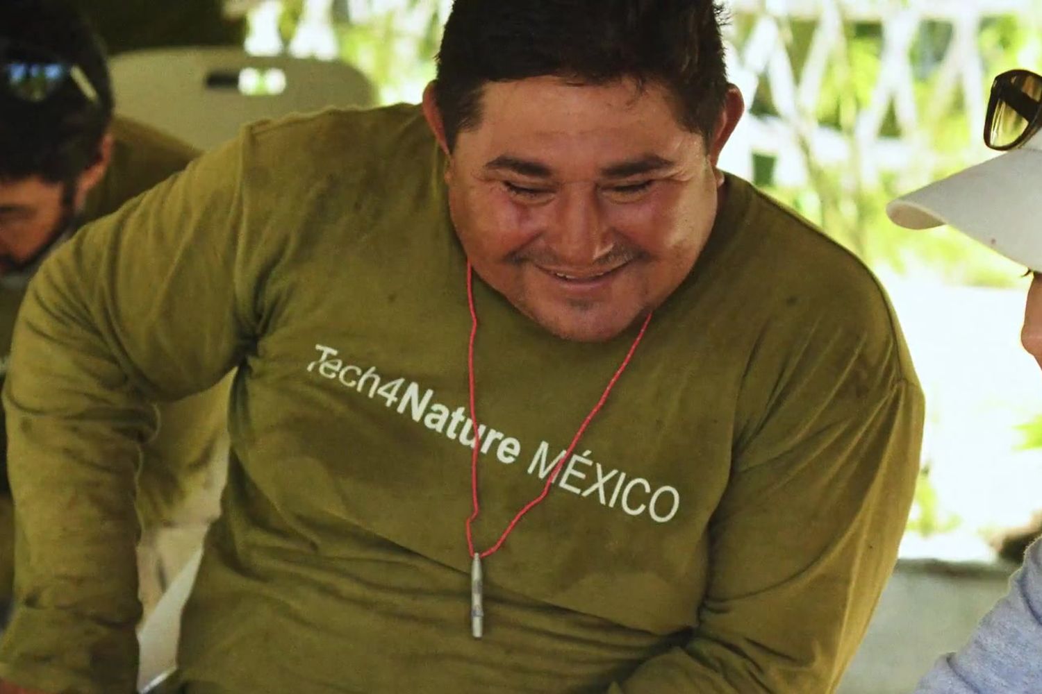 Benjamín Campos smiles in front of a computer