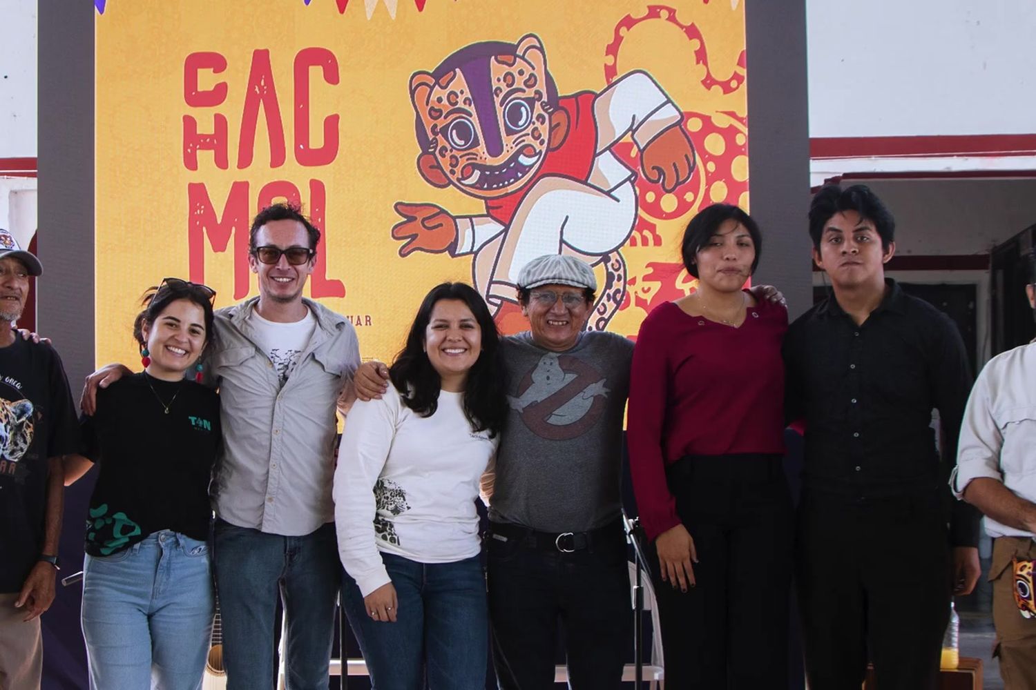 Group in front of the Jaguar Festival mural