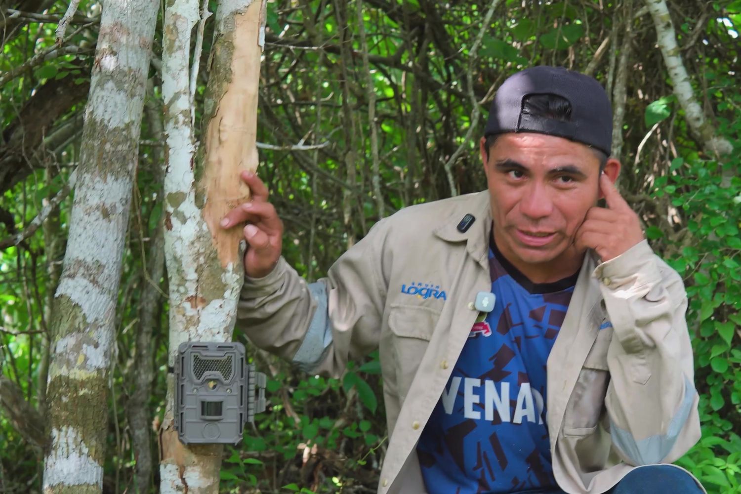 Mateo Ordóñez next to a camera trap