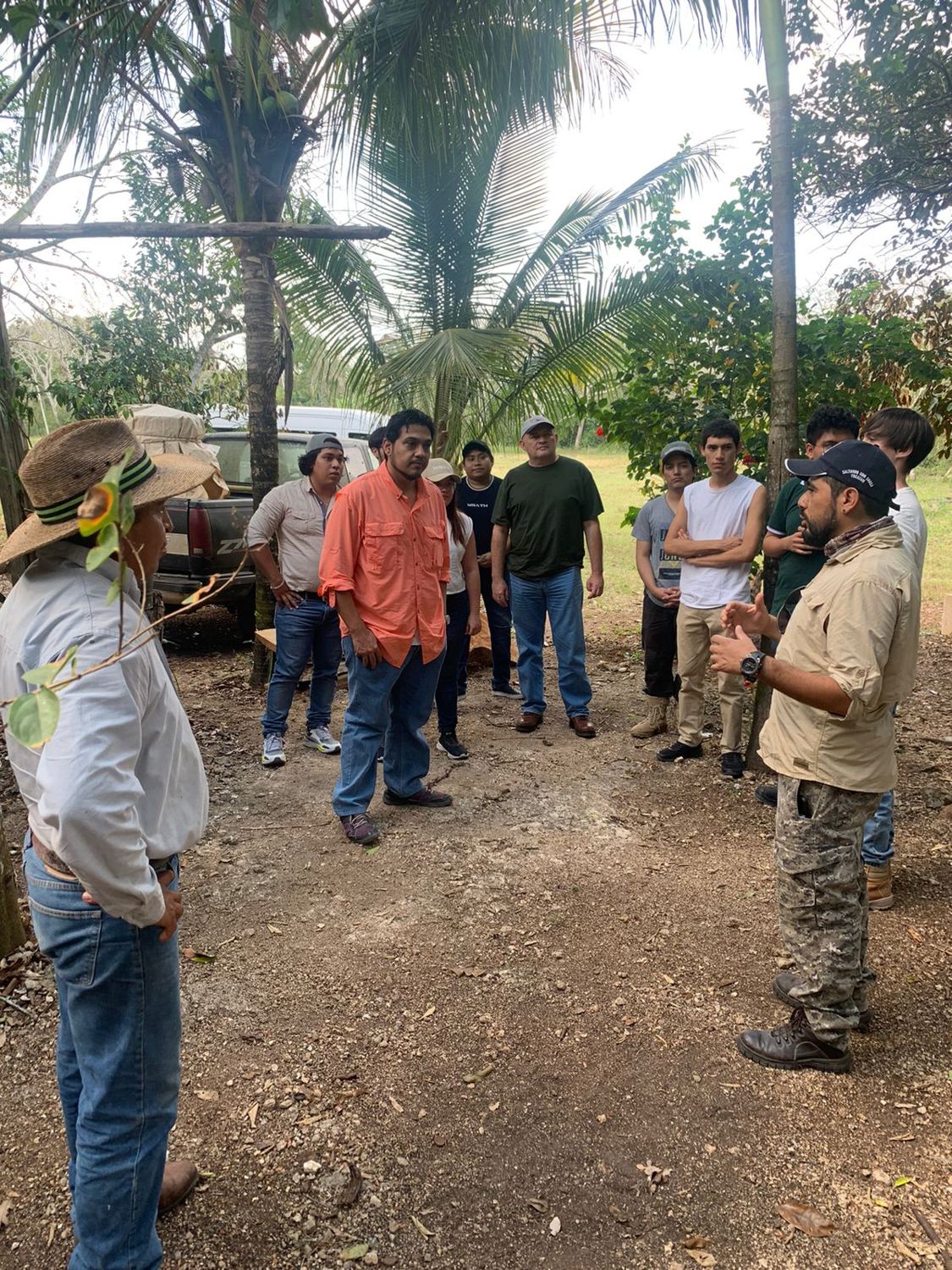 UPY students listen to a guide in the field